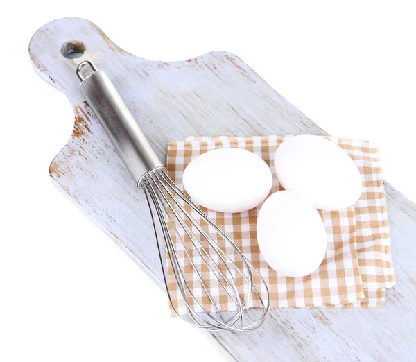 Corolla and eggs on wooden board isolated on white — Stock Photo, Image