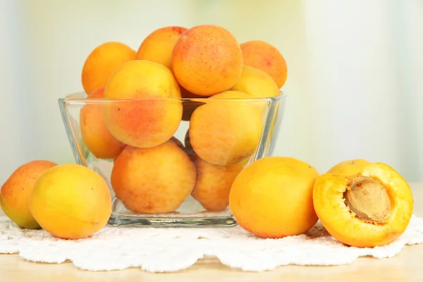 Fresh natural apricot in bowl on table in kitchen — Stock Photo, Image