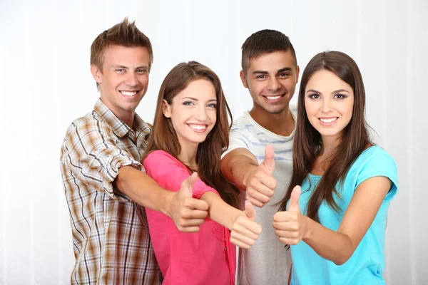 Group of happy beautiful young people at room — Stock Photo, Image
