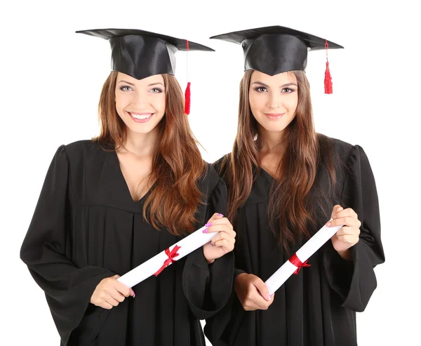 Twee gelukkige afstuderen studenten geïsoleerd op wit — Stockfoto