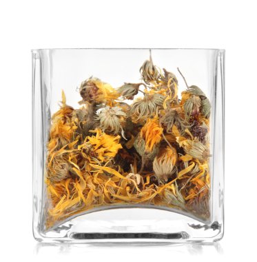 beyaz izole cam kap içinde kuru ot