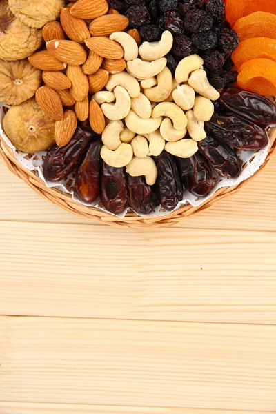 Different dried fruits on wooden background — Stock Photo, Image