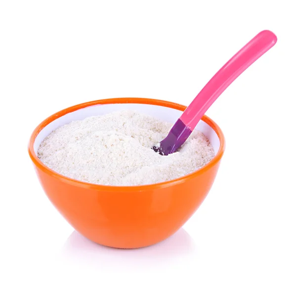 Powdered milk in bowl and spoon for baby isolated on white — Stock Photo, Image