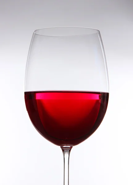 Glass of wine on gray background — Stock Photo, Image