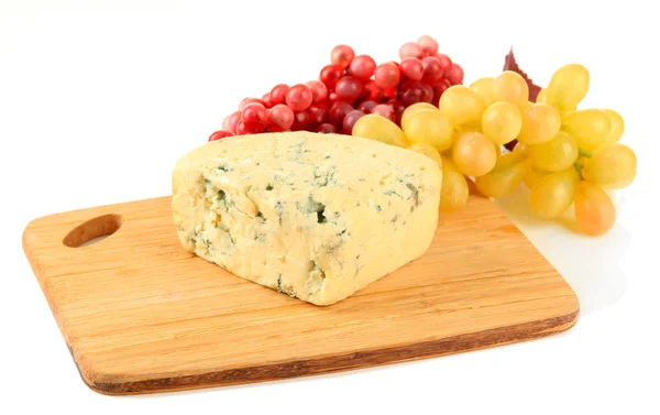 Tasty blue cheese and grape on cutting board, isolated on white — Stock Photo, Image