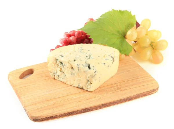 Tasty blue cheese and grape on cutting board, isolated on white — Stock Photo, Image