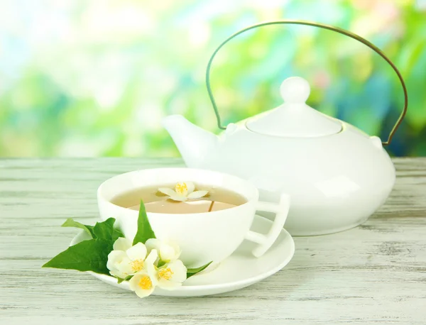 Cup of tea with jasmine, on bright background — Stock Photo, Image