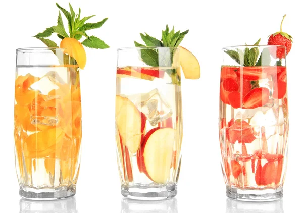 Glasses of fruit drinks with ice cubes isolated on white — Stock Photo, Image