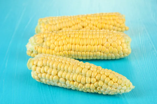 Fresh corn on color wooden background — Stock Photo, Image