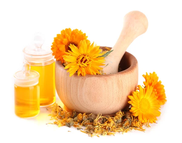 Medicine bottles and calendula flowers in wooden mortar isolated on white — Stock Photo, Image