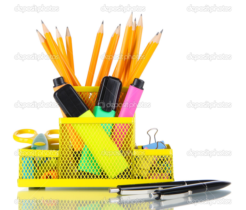 Office equipment in yellow stationary holder isolated on white