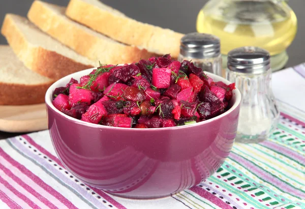 Beet salad in bowl on table close-up — Stock Photo, Image