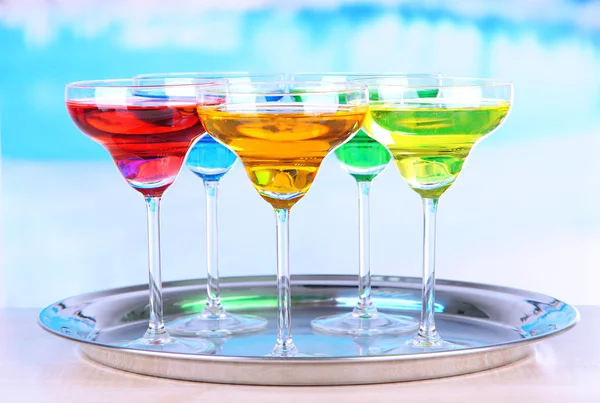 Different cocktails on bright background — Stock Photo, Image