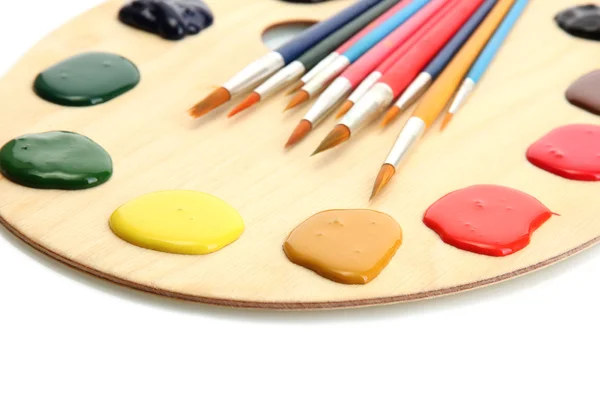 Wooden art palette with paint and brushe — Stock Photo, Image