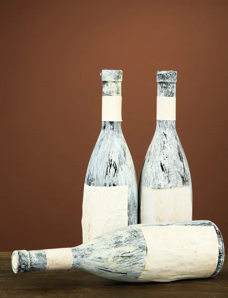 Old bottles of wine, on dark brown background — Stock Photo, Image