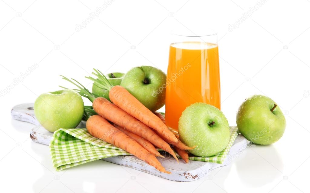 Glass of juice, apples and carrots, isolated on white