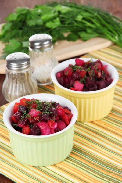 Beet salad in bowls on table close-up — Stock Photo, Image