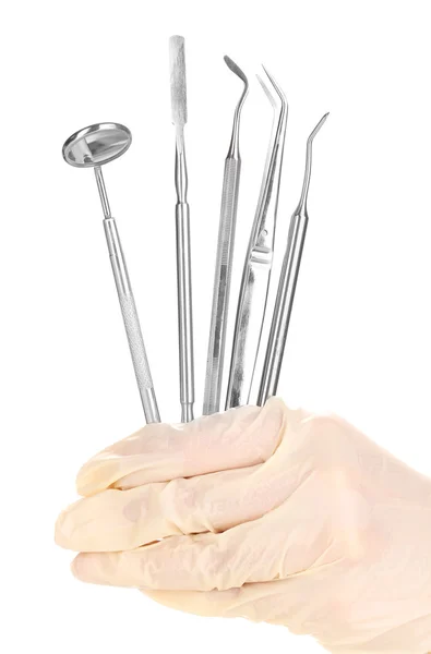 Set of dental tools in dentists hands isolated on white — Stock Photo, Image