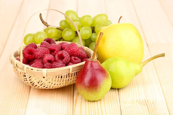 Ripe sweet fruits and berries on wooden background — Stock Photo, Image