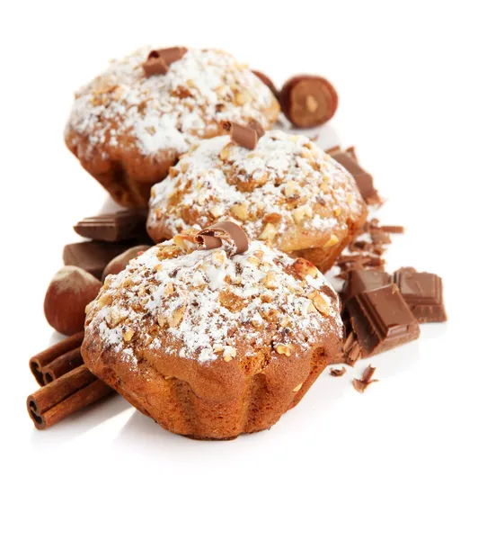 Tasty muffin cakes with powdered sugar and chocolate, isolated on white — Stock Photo, Image