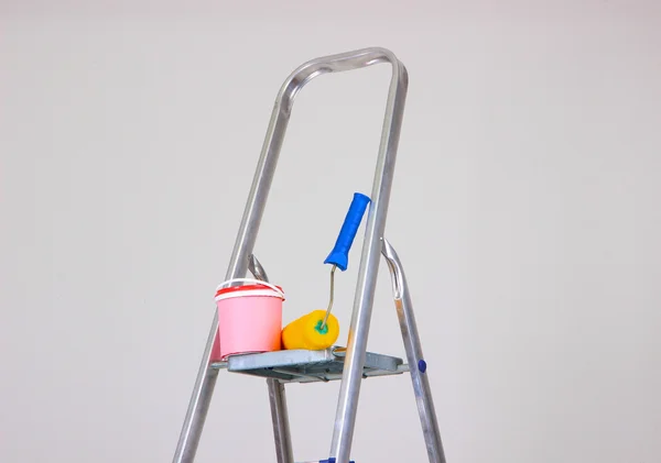 Metal ladder and paint in room — Stock Photo, Image