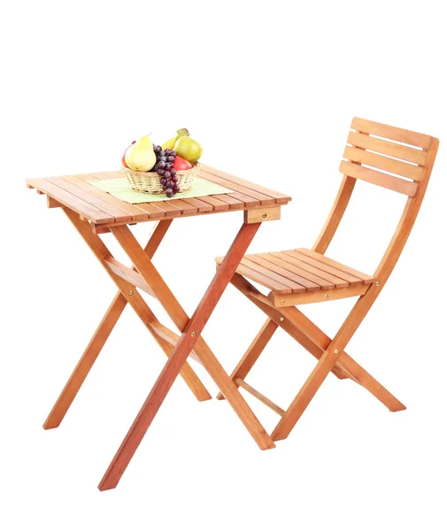 Houten tafel met fruit geïsoleerd op wit — Stockfoto