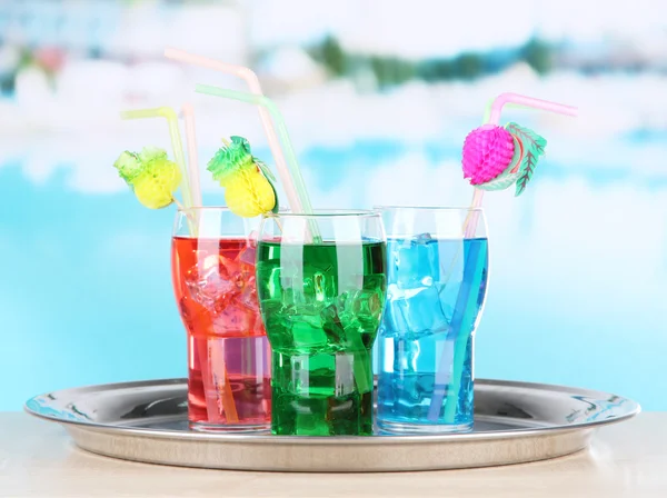 Different cocktails on bright background — Stock Photo, Image