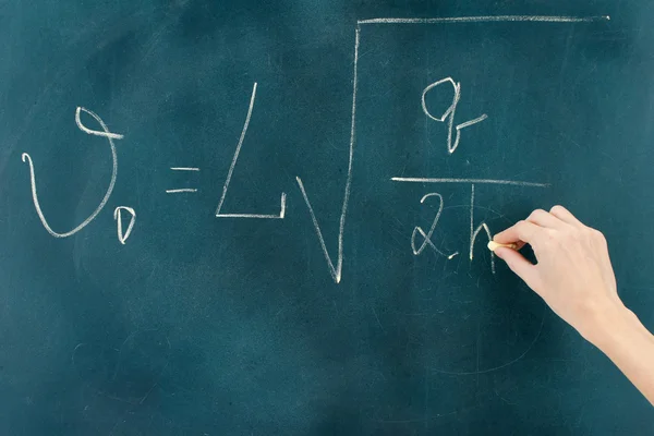 Physics formula written on blackboard with chalk. — Stock Photo, Image