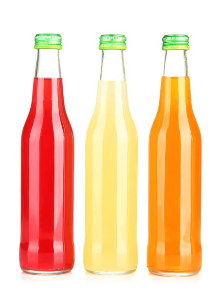 Bottles with tasty drink, isolated on white — Stock Photo, Image