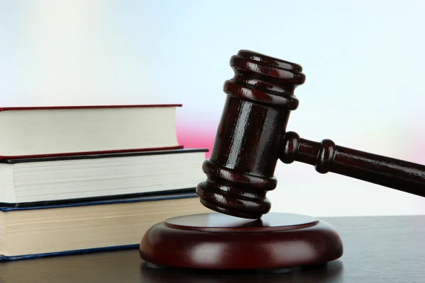 Gavel and books on table on light background — Stock Photo, Image