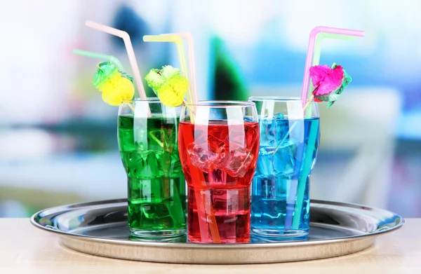Different cocktails on bright background — Stock Photo, Image