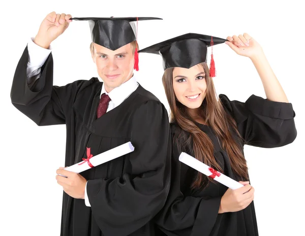 Dois estudantes graduados felizes isolados em branco — Fotografia de Stock