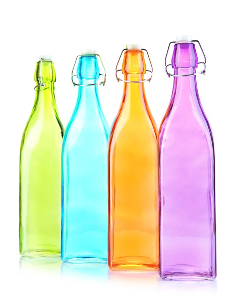 Empty color glass bottles, isolated on white — Stock Photo, Image