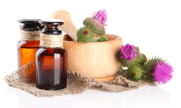 Medicine bottles and mortar with thistle flowers, isolated on white — Stock Photo, Image