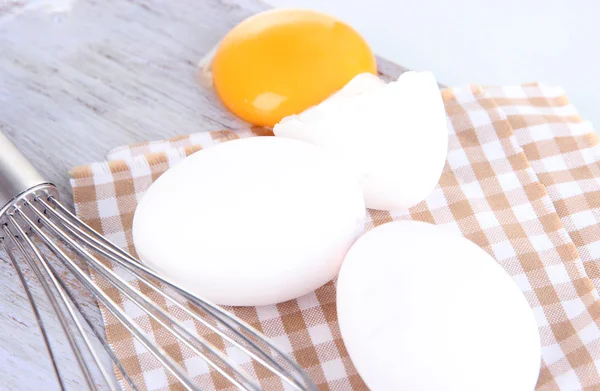 Corolla and eggs on wooden board isolated on white — Stock Photo, Image