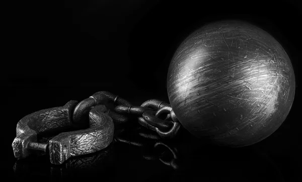 Ball and chain on black background — Stock Photo, Image