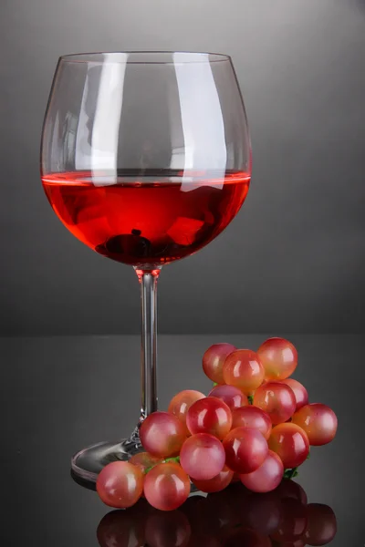 Red wine glass on grey background — Stock Photo, Image