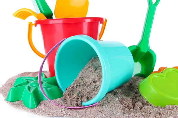 Brinquedos de crianças em areia isolada em branco — Fotografia de Stock
