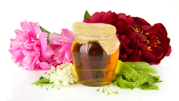 Jar of honey, honeycombs with flowers of lime, peony, acacia, isolated on white — Stock Photo, Image