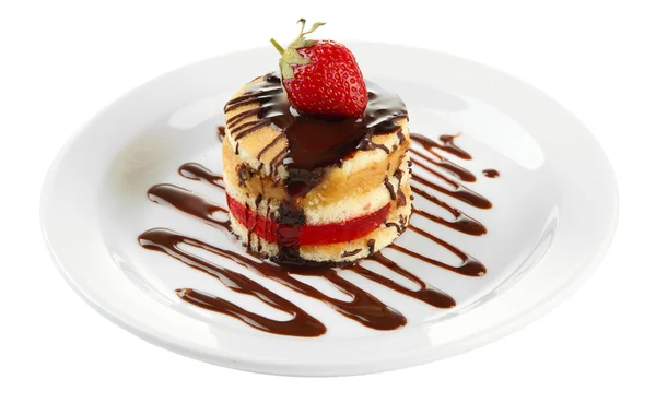 Tasty biscuit cake with chocolate and berry on plate, isolated on white — Stock Photo, Image