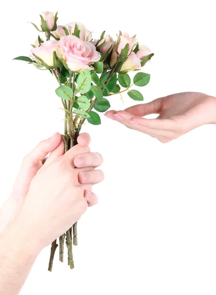 Mão do homem dando uma rosas isoladas em branco — Fotografia de Stock