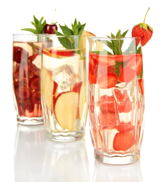Glasses of fruit drinks with ice cubes isolated on white — Stock Photo, Image