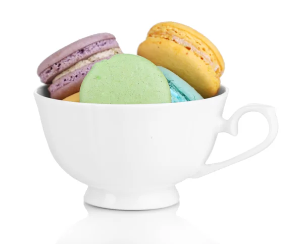 Macaroons in cup isolated on white — Stock Photo, Image