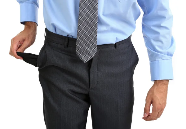 Hombre de negocios mostrando su bolsillo vacío, aislado en blanco — Foto de Stock