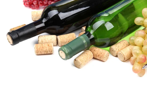 Bottles of wine, grapes and corks, isolated on white — Stock Photo, Image