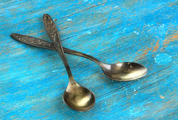 Vintage metal spoons on wooden table close-up — Stock Photo, Image