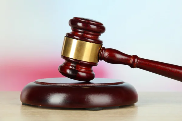 Judges gavel on wooden table on light background — Stock Photo, Image