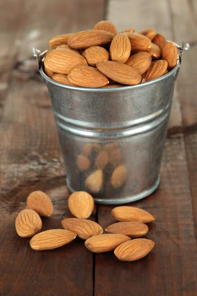 Almond on wooden background — Stock Photo, Image