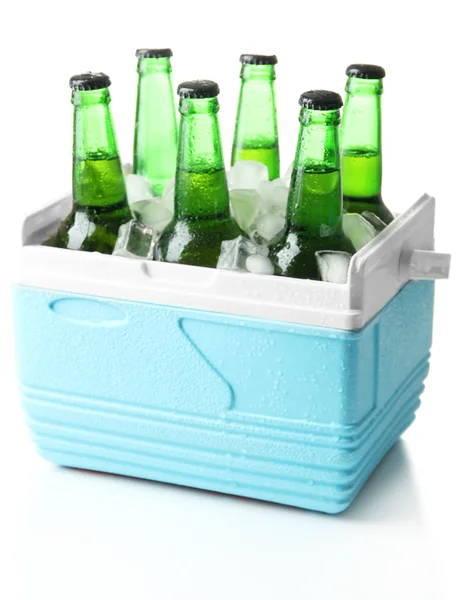 Bottles of beer with ice cubes in mini refrigerator, isolated on white — Stock Photo, Image