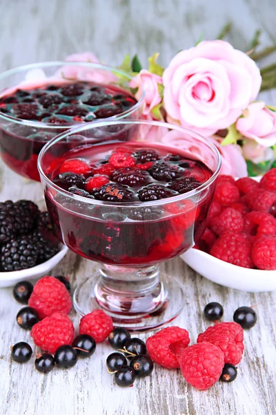 Jelly with fresh berries on wooden table close up — Stock Photo, Image